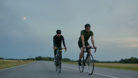 Two-fit-cyclists-race-against-each-other-on-the-road